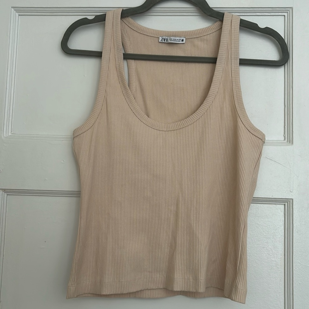 Zara size M. Stretchy light cream ribbed tank top.